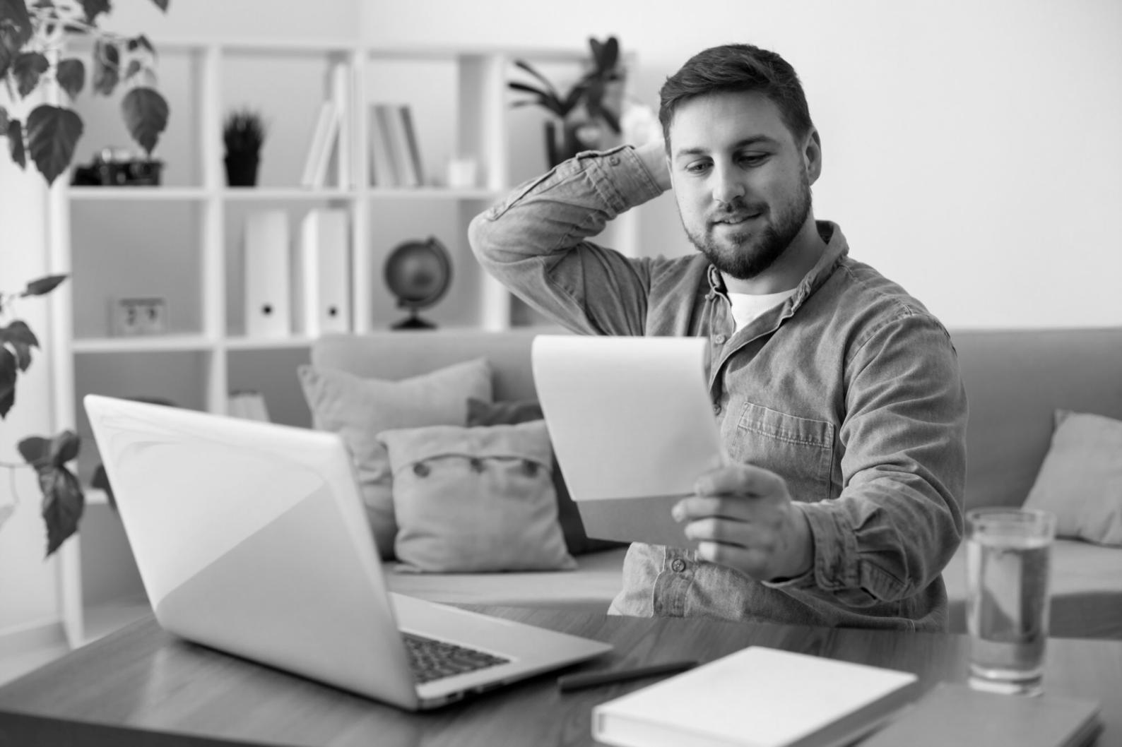 Business professional reviewing fraud detection analytics on computer screen